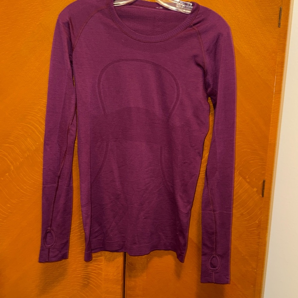 Wine color lululemon top.